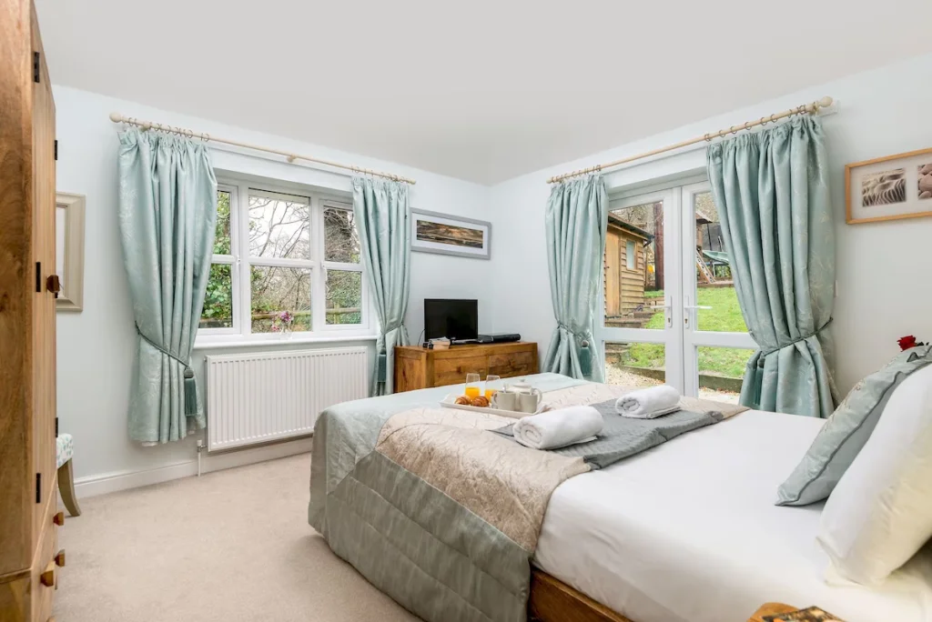 Bright cozy bedroom with garden view and modern decor