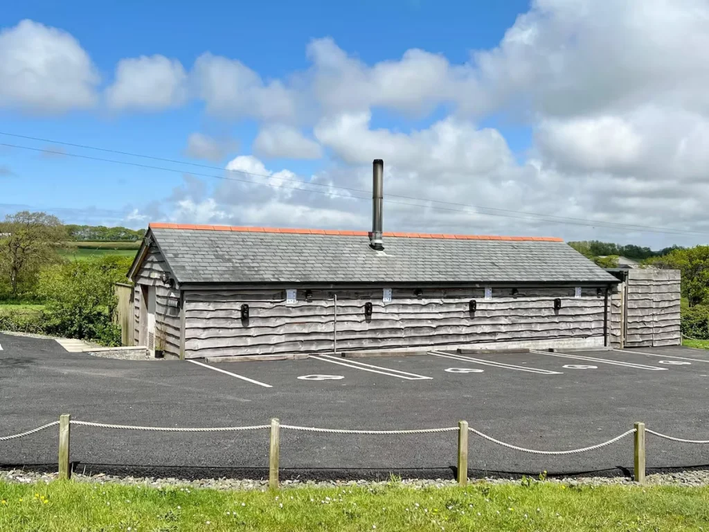 Wooden building with parking lot in rural setting