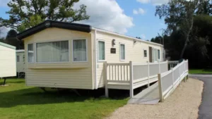 Mobile home with ramp in sunny outdoor setting