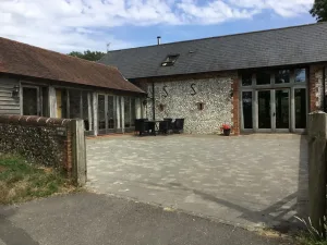 Barn converted into a modern living space with patio