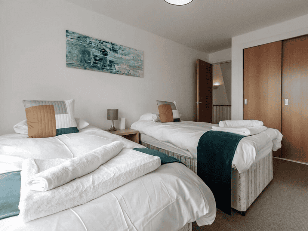Modern twin bedroom with clean, stylish decor