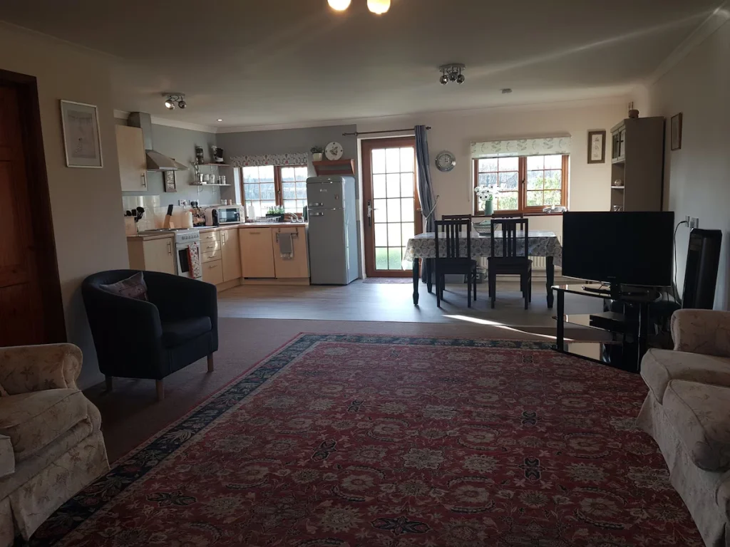 Spacious living room with integrated kitchen and dining area