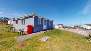 Coastal prefab home with clear blue sky