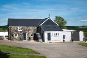 Renovated barn house with stone walls in countryside