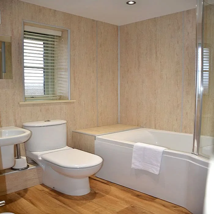 Modern bathroom interior with tub, toilet, and basin