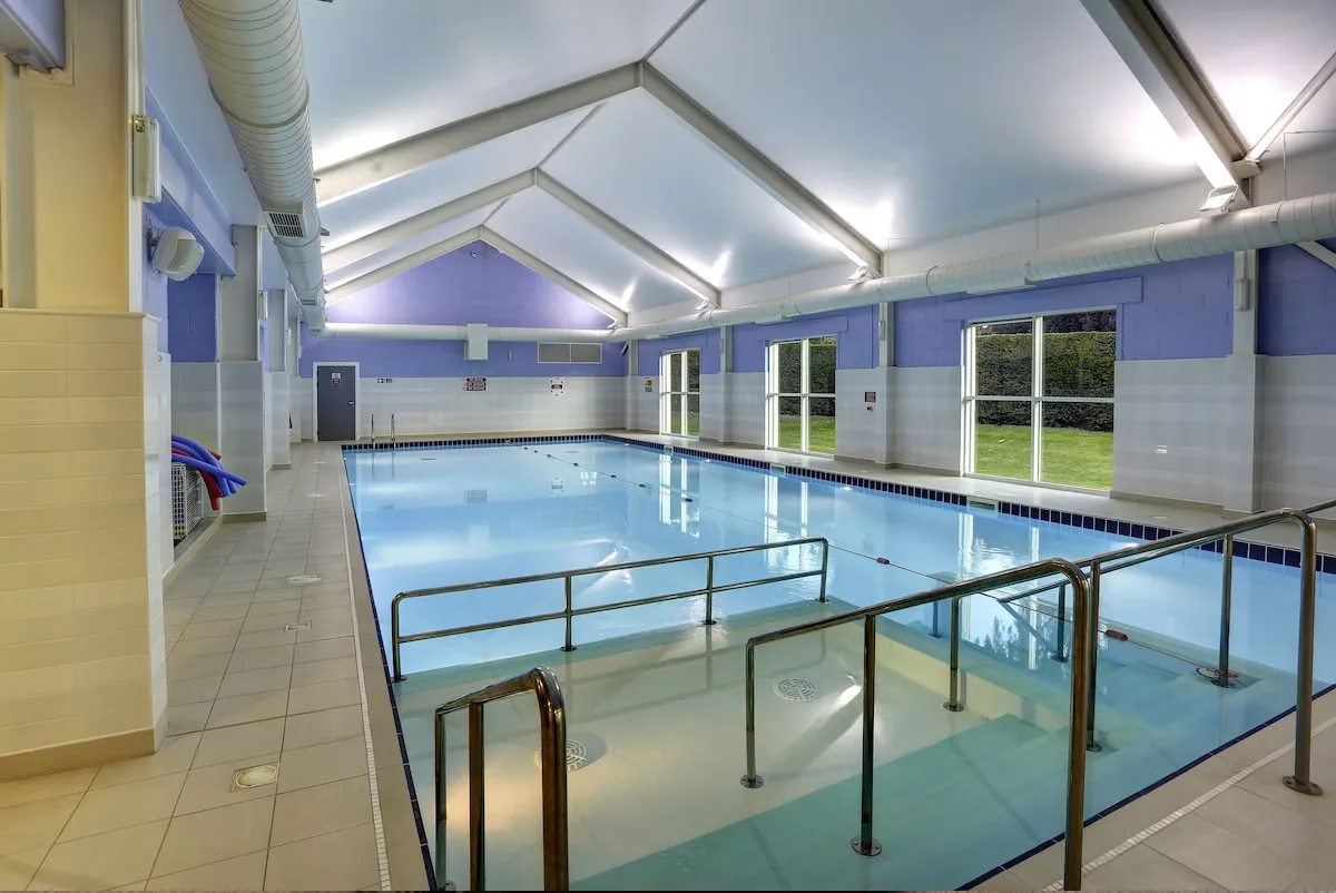Indoor swimming pool with blue and white tiles