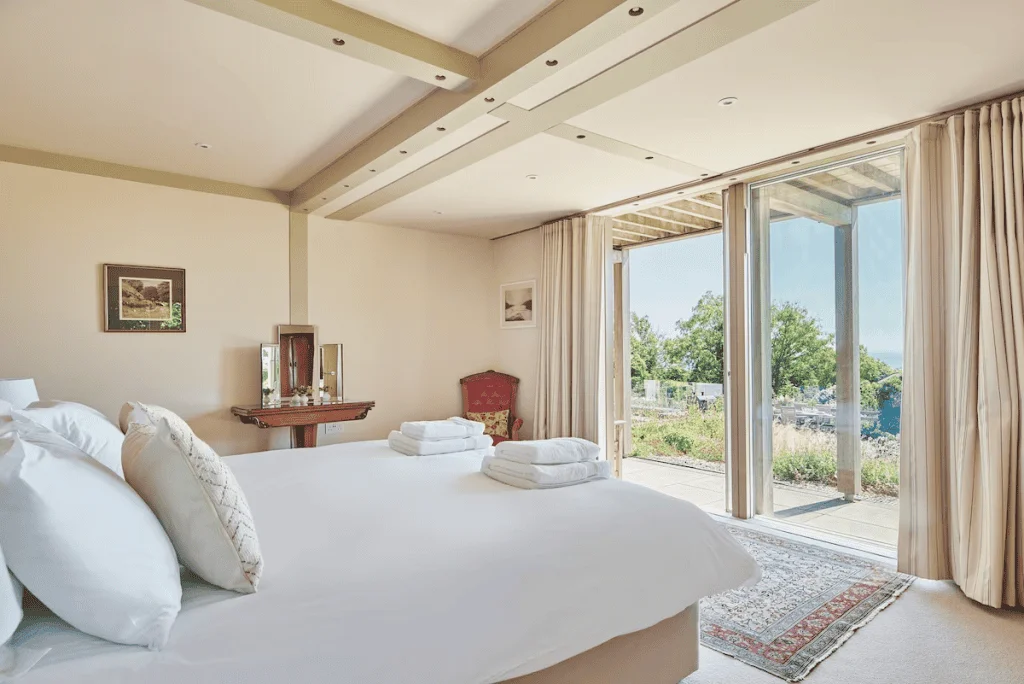 Bright, airy bedroom with large sliding glass door