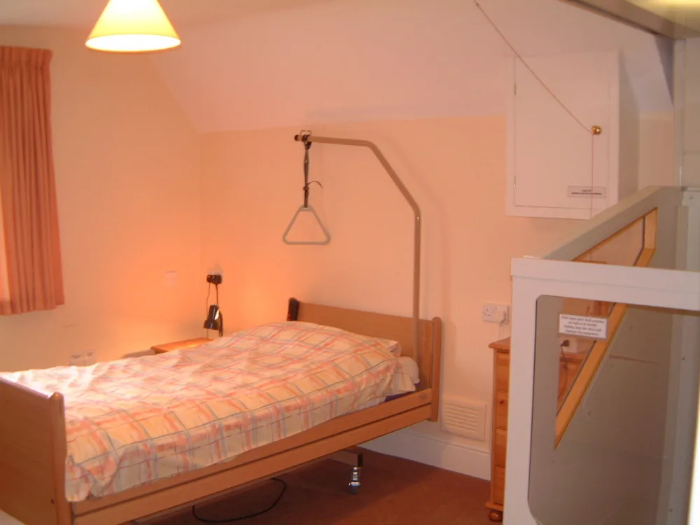 Cozy bedroom with single bed and soft lighting