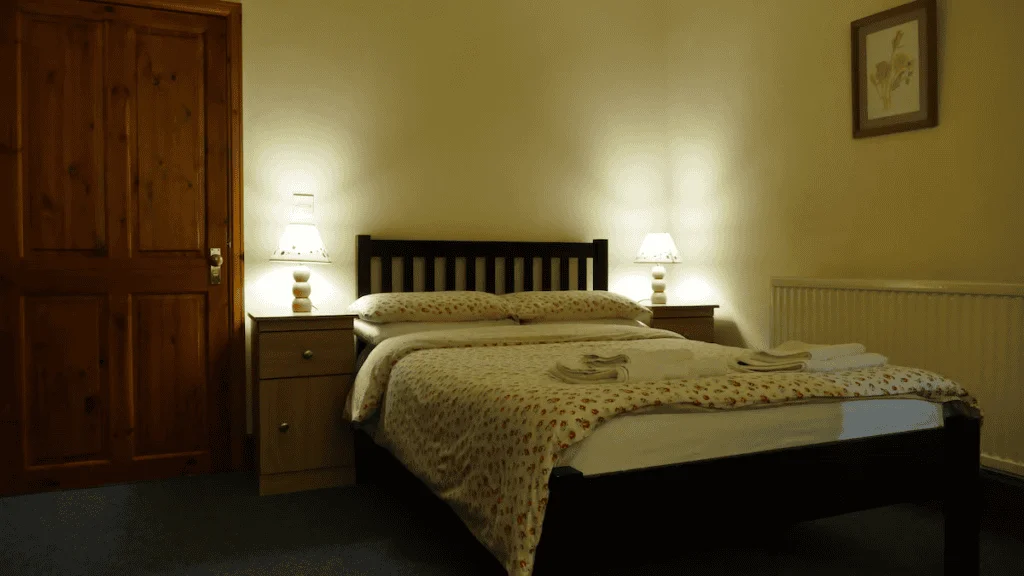 Cozy bedroom with wooden furniture and warm lighting