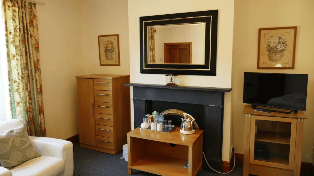 Cozy hotel room with fireplace and modern amenities