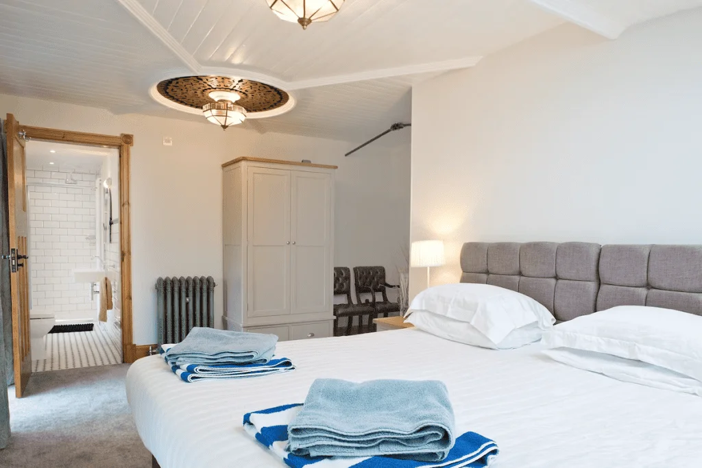 Spacious bedroom with open ensuite bathroom and elegant decor