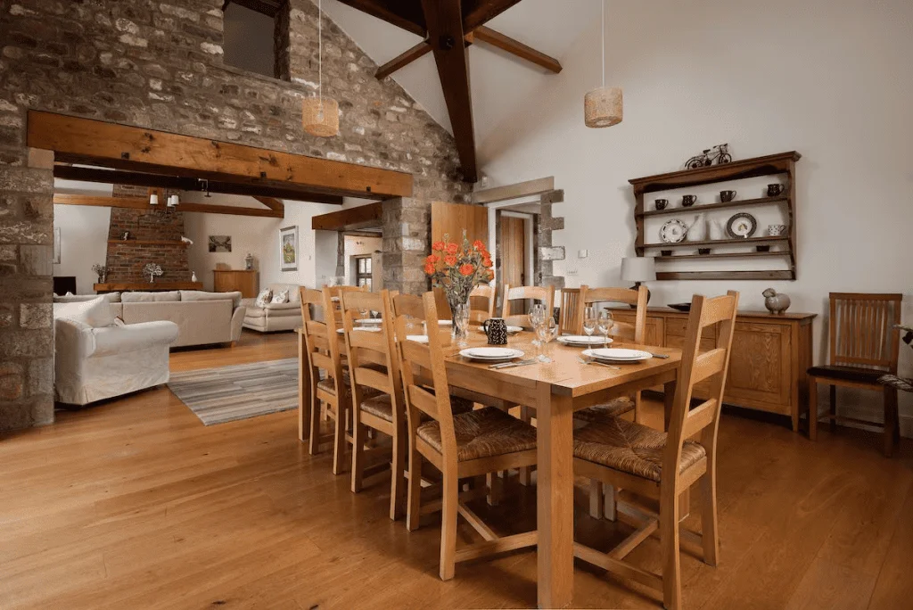 Rustic dining room with wooden beams and stone walls