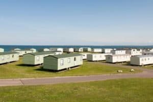 Coastal caravan park with sea backdrop