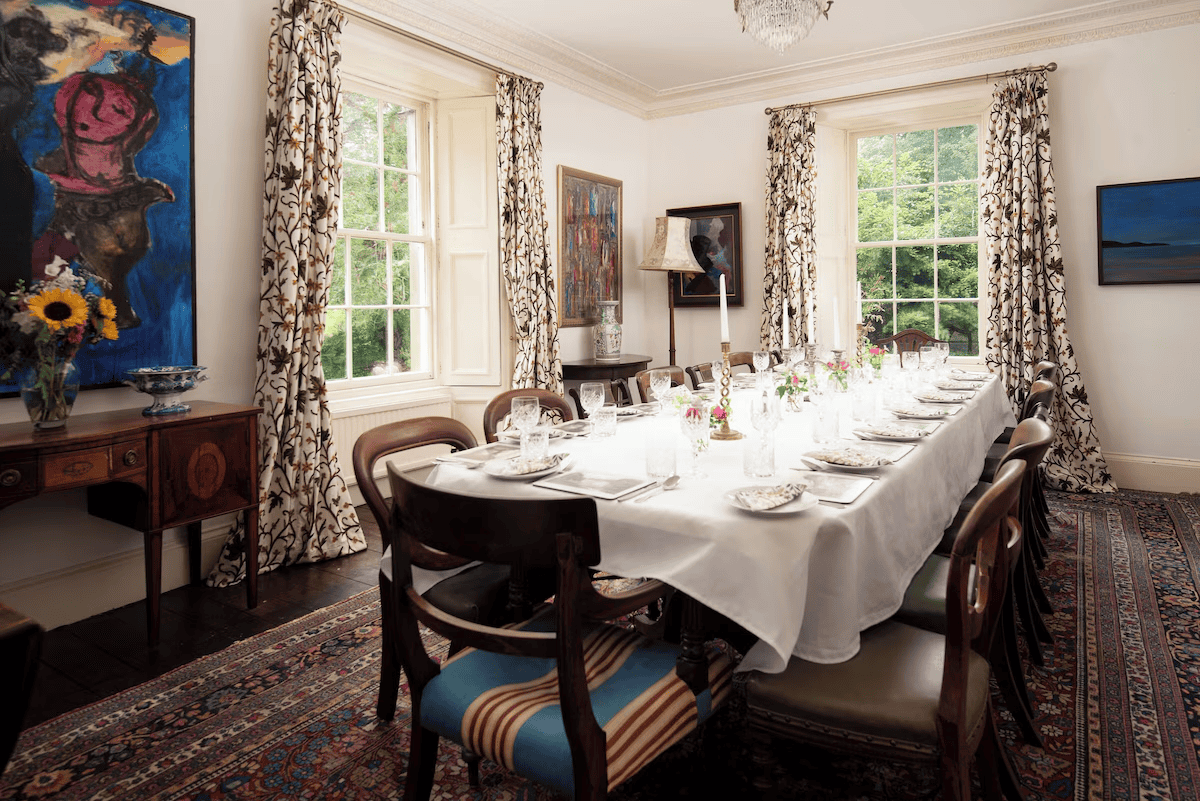 Elegant dining room with art and set table