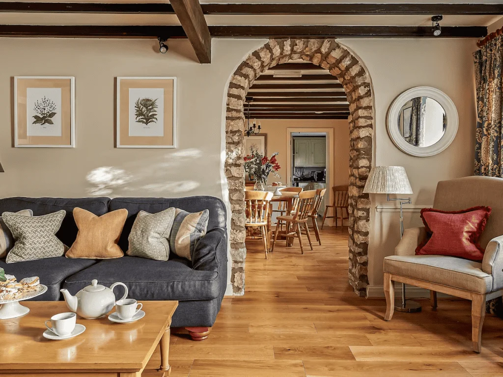 Cozy living room with archway to dining area