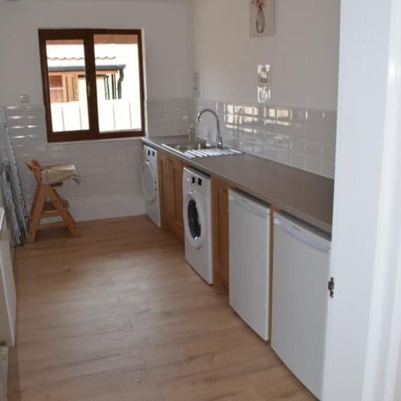 Modern kitchen interior with wooden floors and appliances
