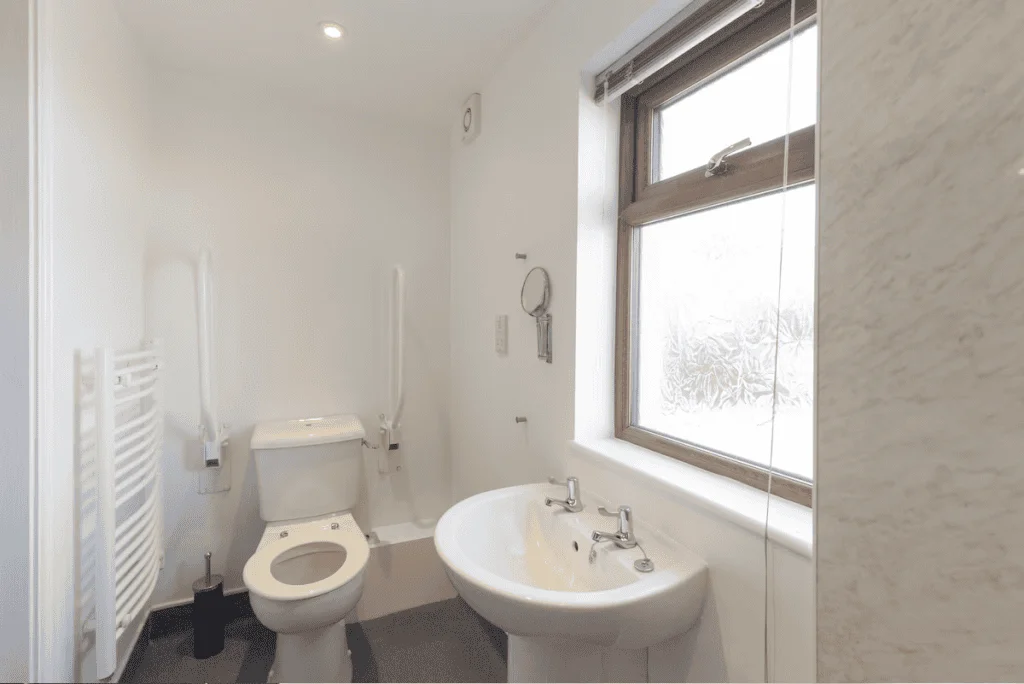 Modern bright white bathroom with window