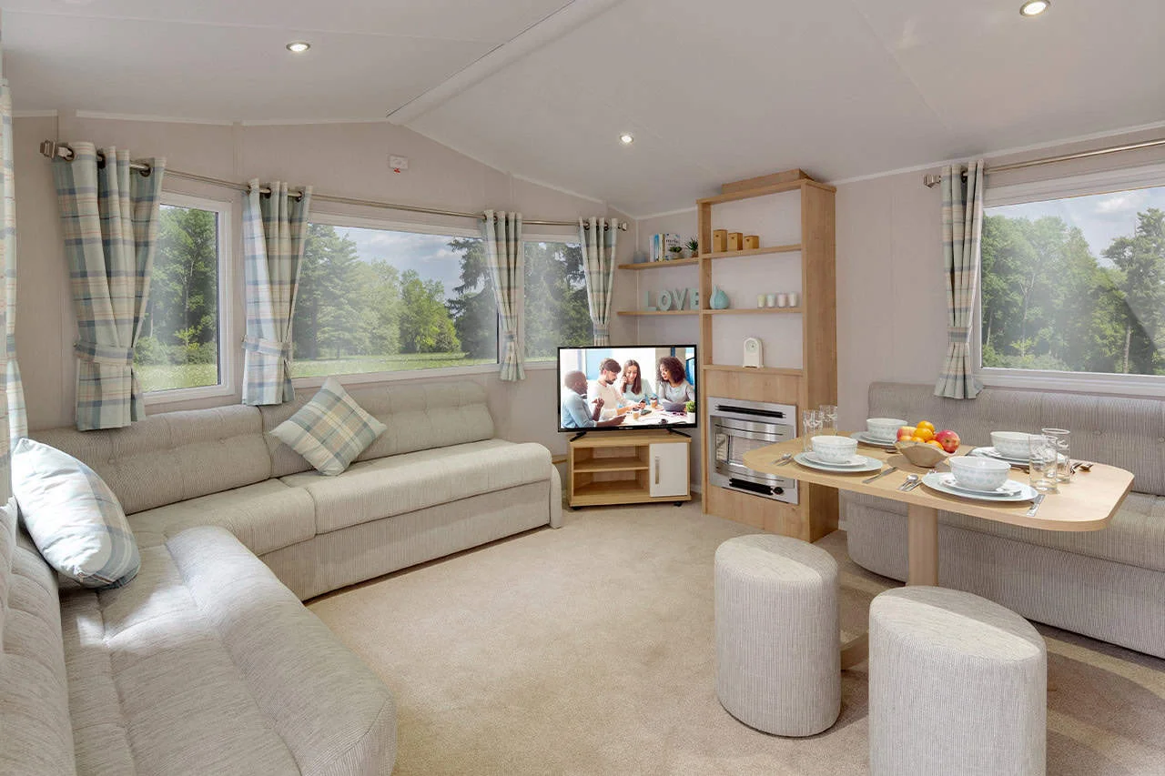 Cozy caravan interior with plush seating and scenic view