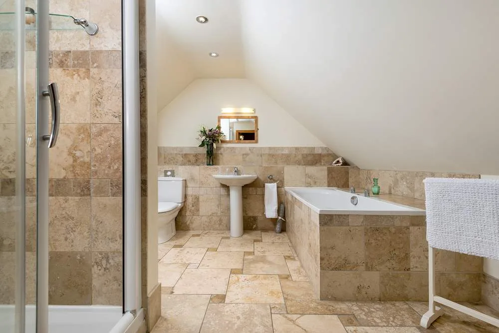 Spacious modern bathroom with shower and tub
