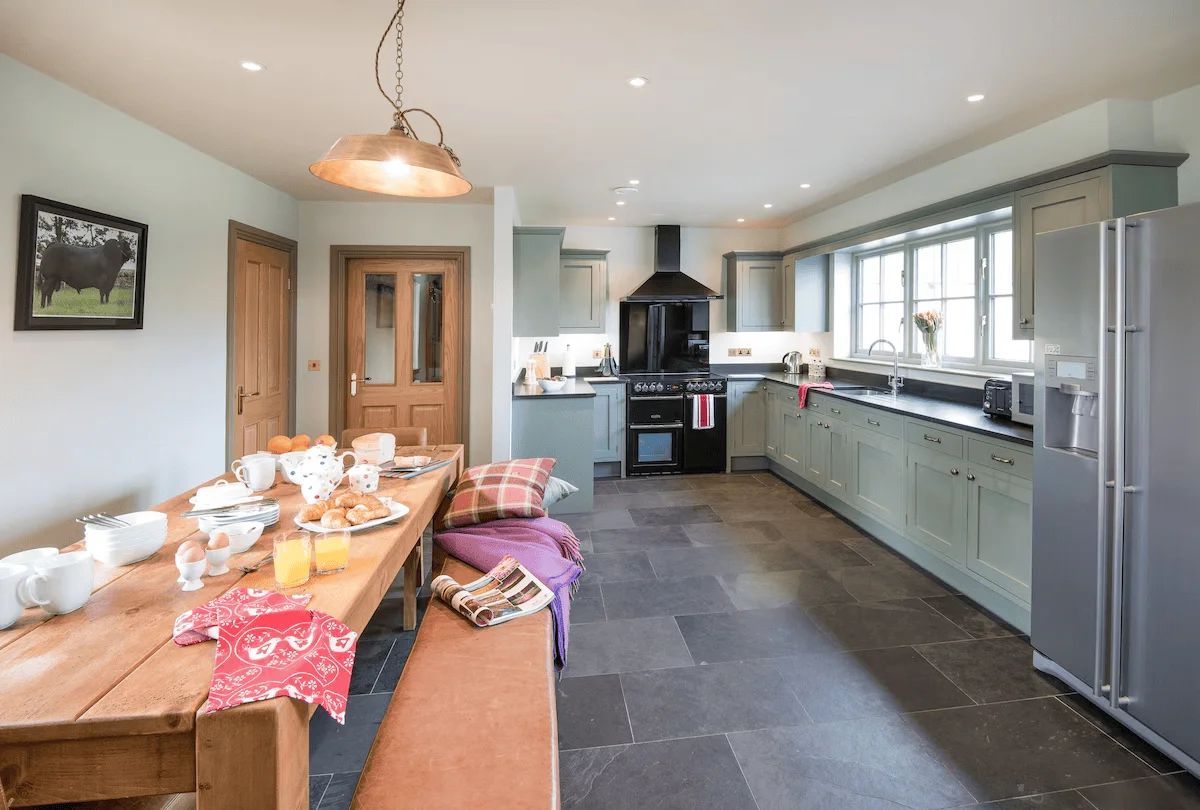 Spacious modern kitchen with breakfast table set