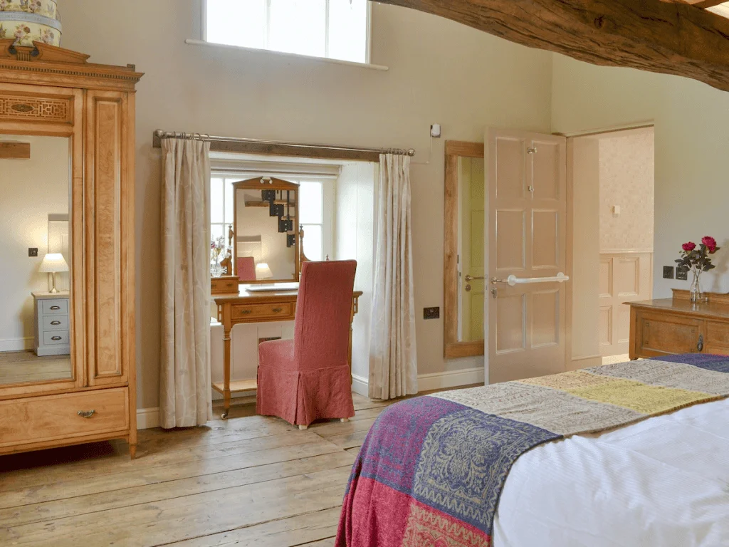 Elegant rustic bedroom with wooden beams and furnishings