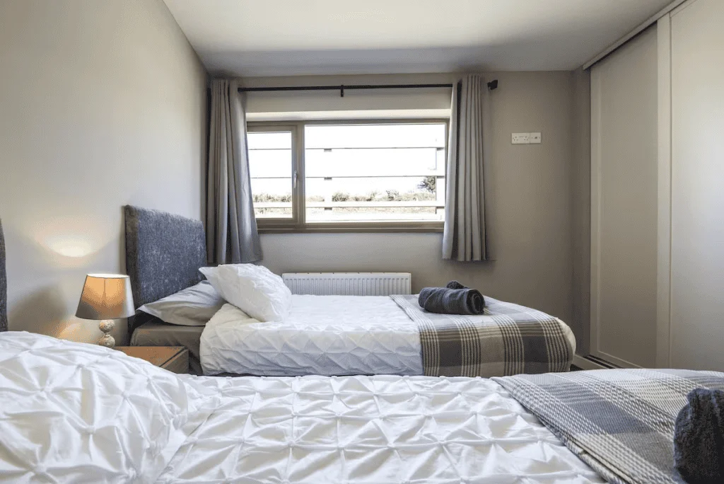 Cozy modern twin bedroom with natural light