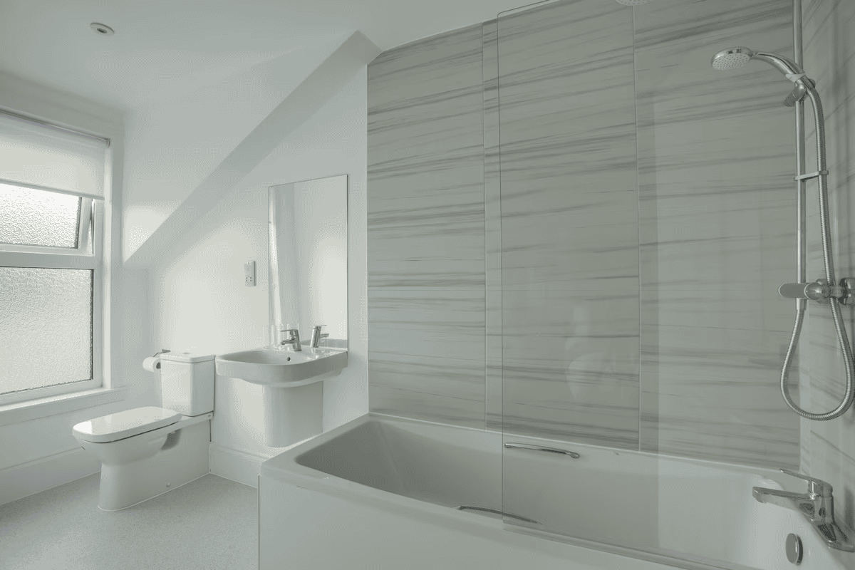 large ensuite bathroom with shower over bath