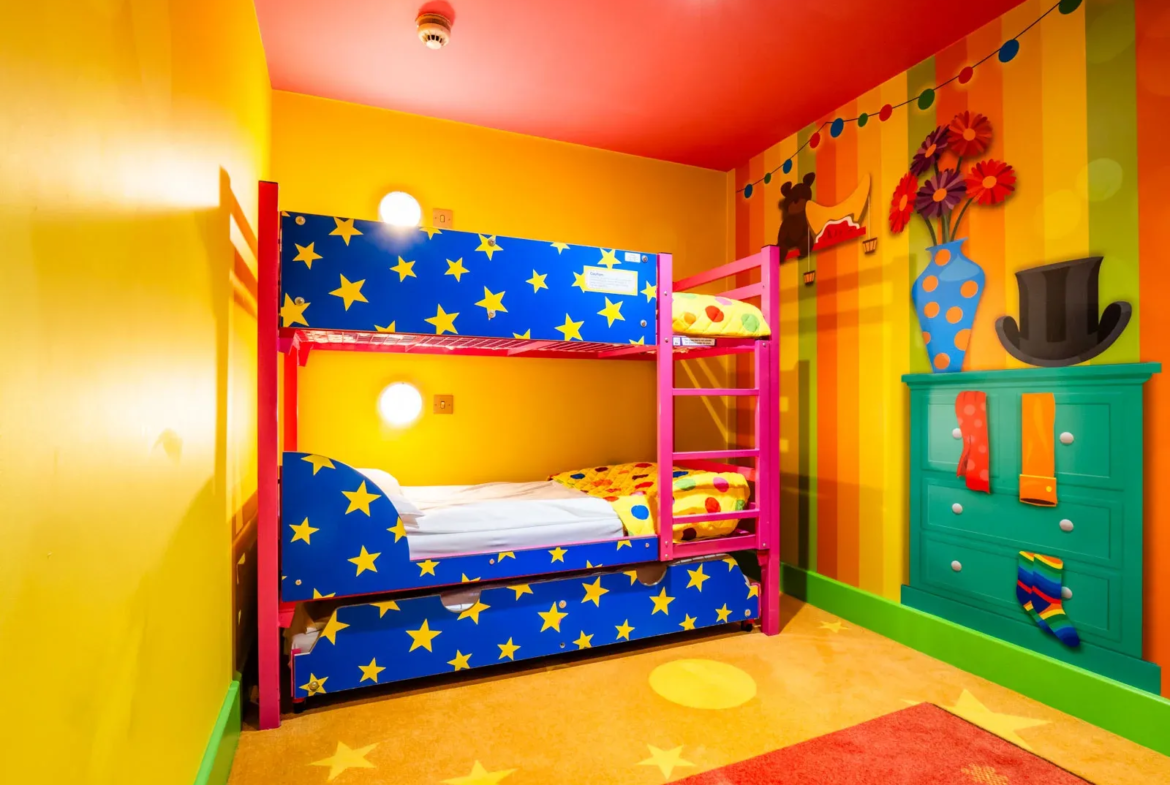 Colourful kids' bedroom with bunk bed and decorations.