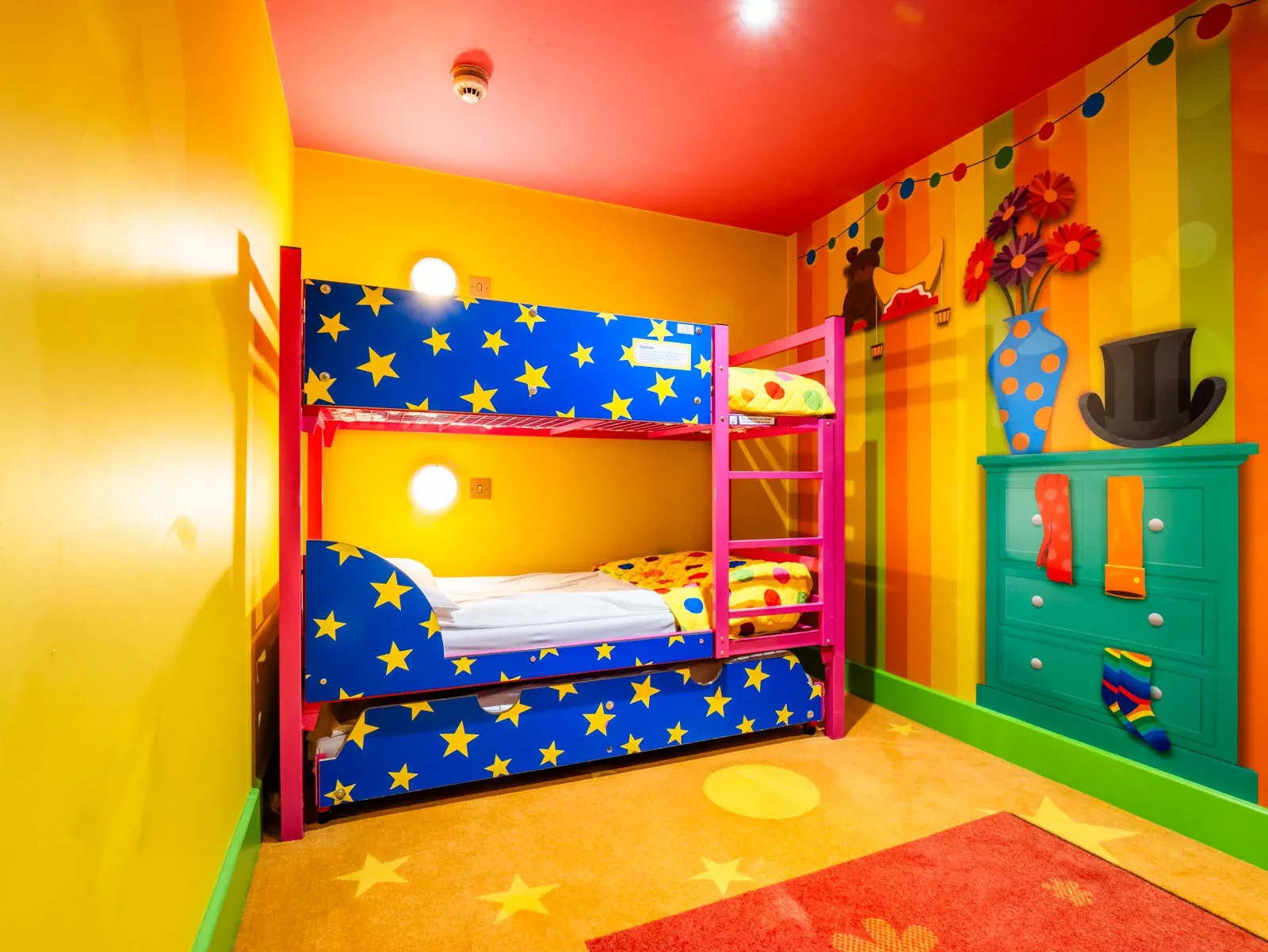 Colourful kids' bedroom with bunk bed and decorations.