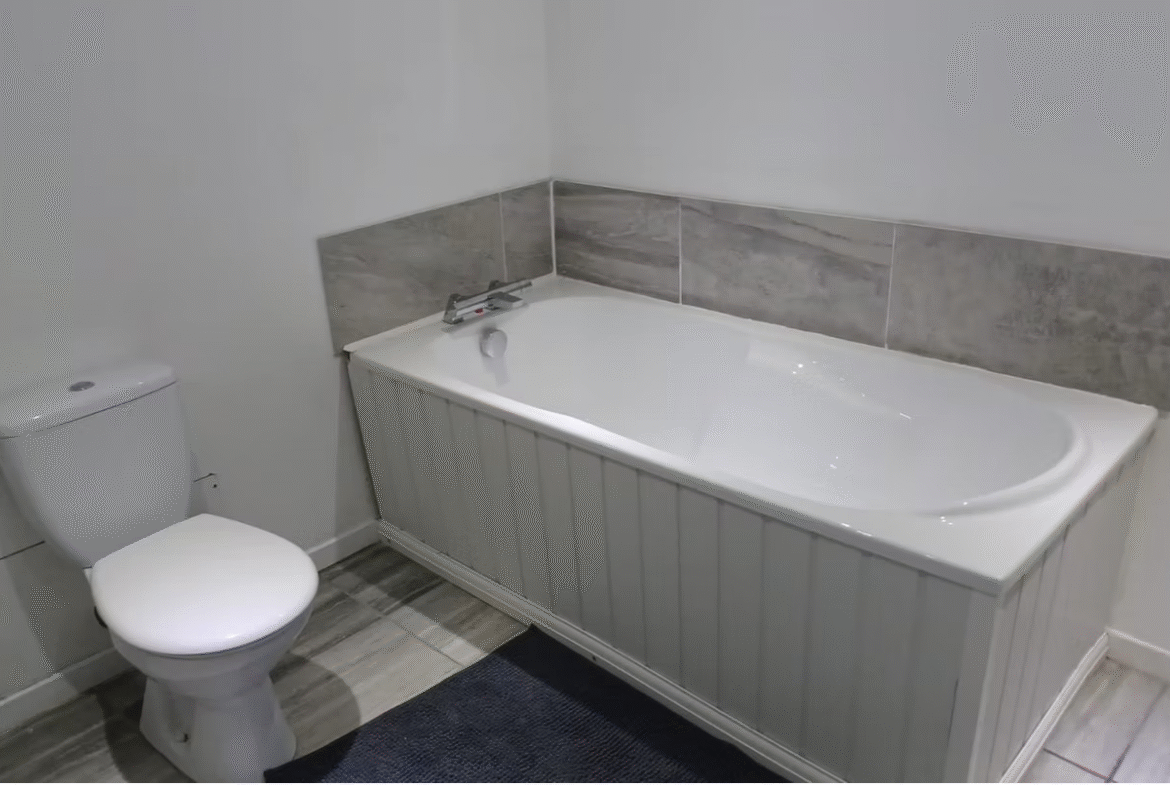 Modern bathroom with bathtub and toilet