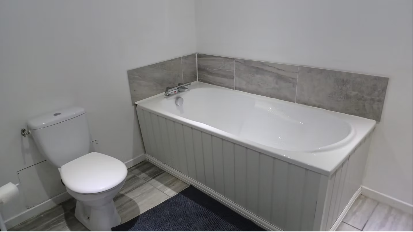 Modern bathroom with bathtub and toilet