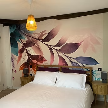 Bedroom with floral wall art and modern decor.