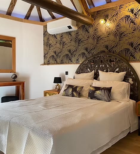 Cosy bedroom with elegant decor and air conditioning.