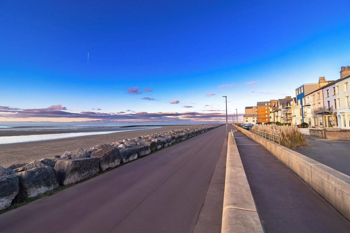 Promenade by the beach at sunset.