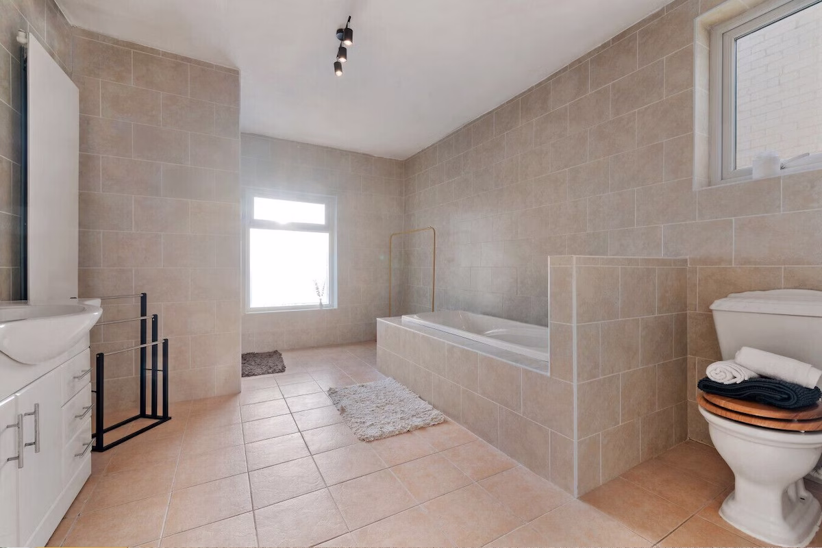 Modern bathroom with bathtub and toilet