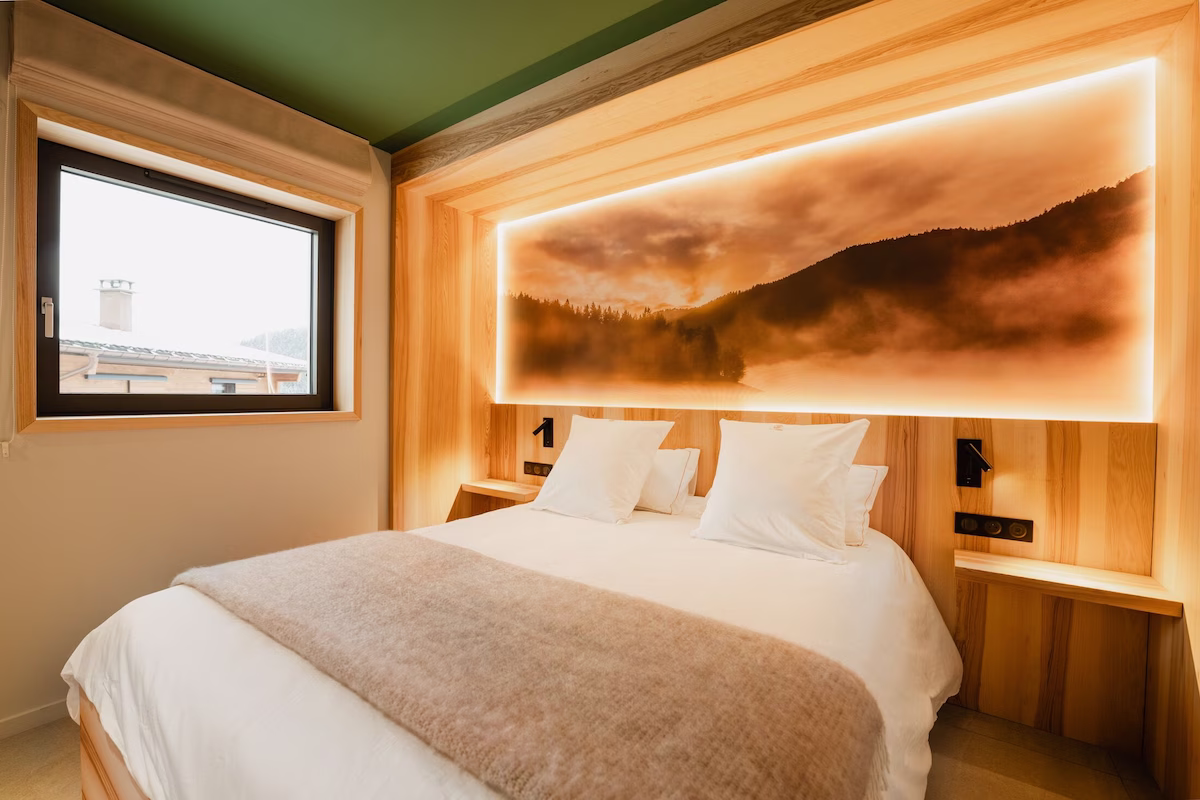 Cosy hotel room with mountain artwork
