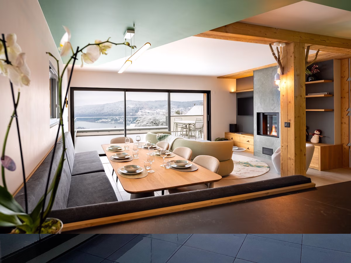 Modern open-plan dining room with scenic view