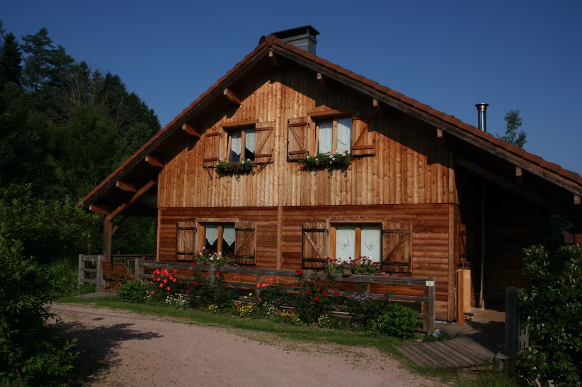 Wooden cabin with garden and greenery