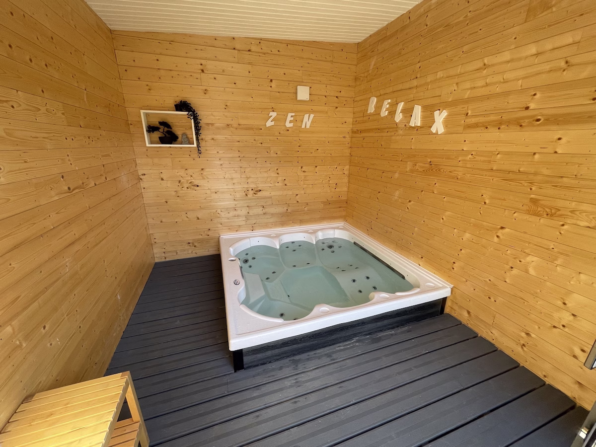 Eco Hot Tub Wood-panelled room with a jacuzzi, Zen Relax decor.