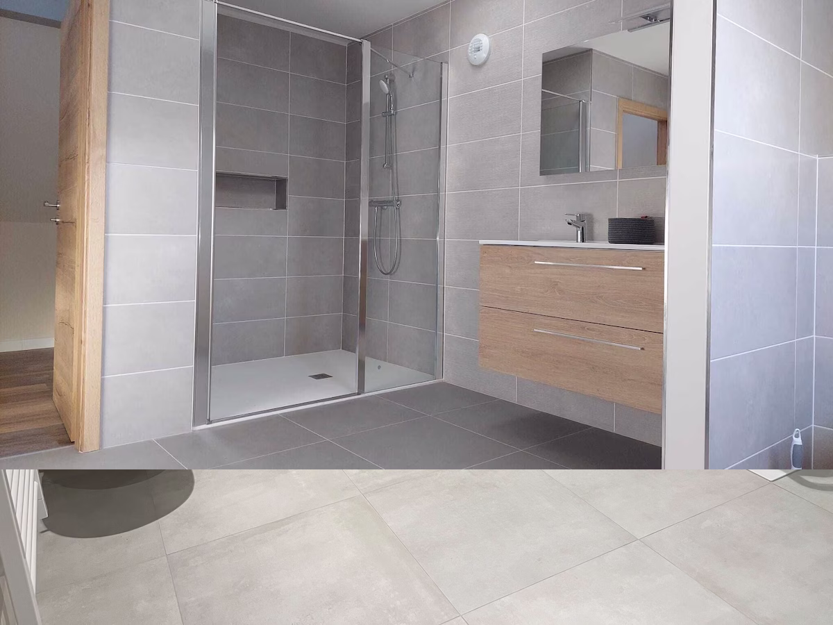 Modern bathroom with grey tiles and walk-in shower