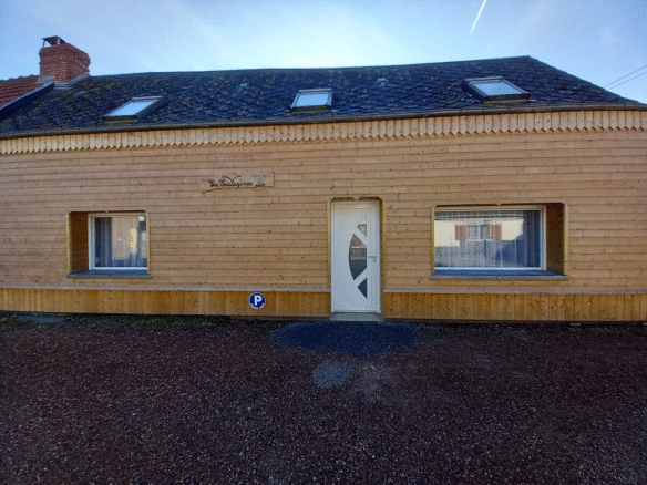 Wooden house facade with parking sign