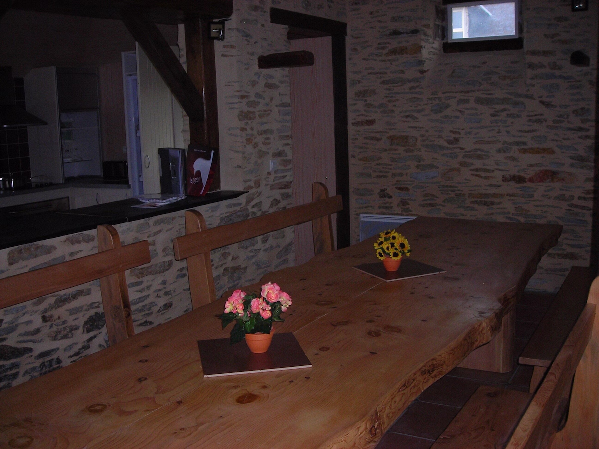 Rustic dining area with wooden tables and chairs
