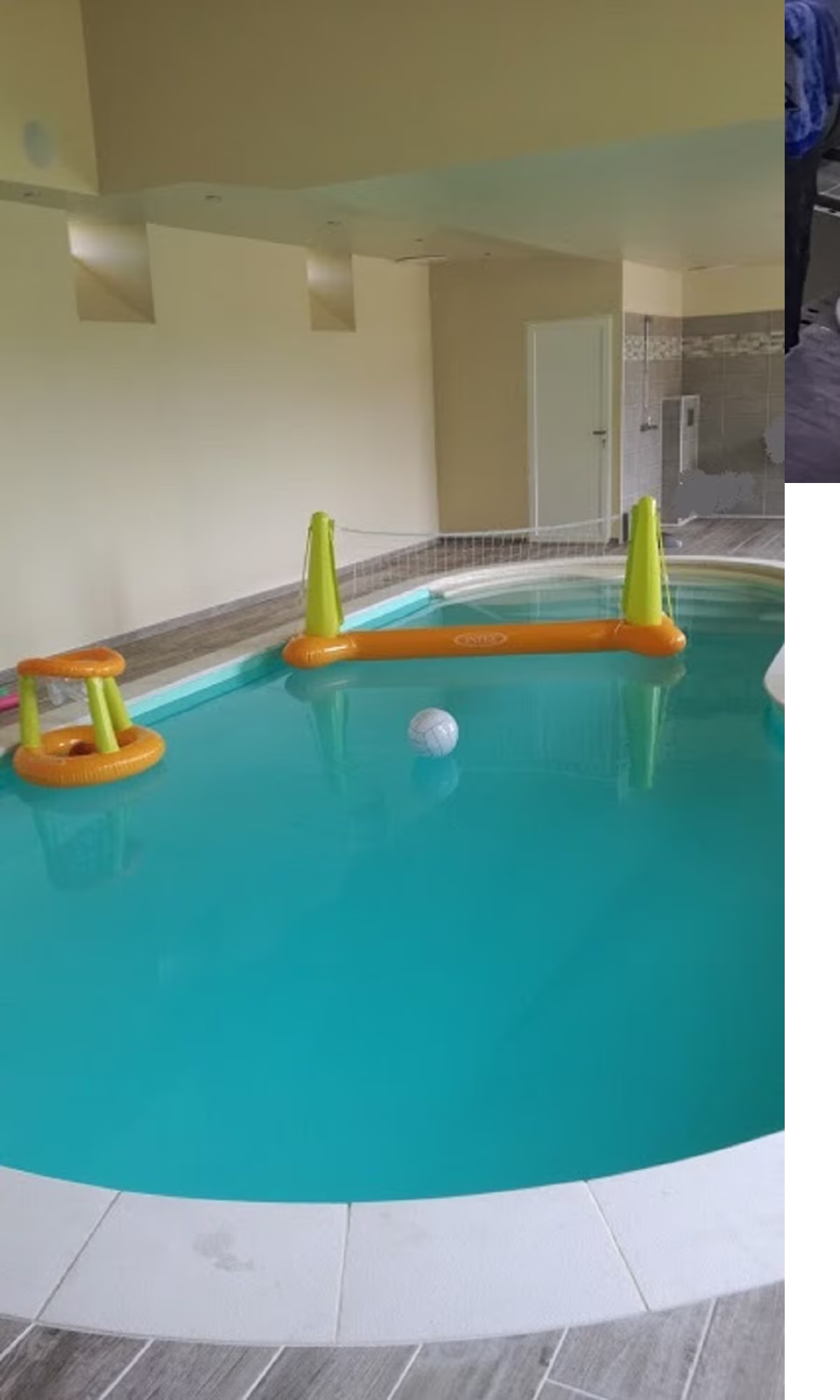 Indoor pool with inflatable volleyball net