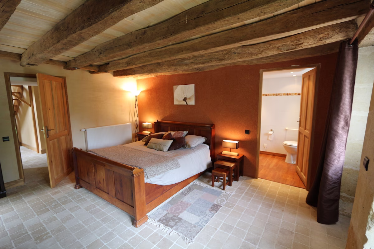 Cosy rustic bedroom with wooden beams and en-suite